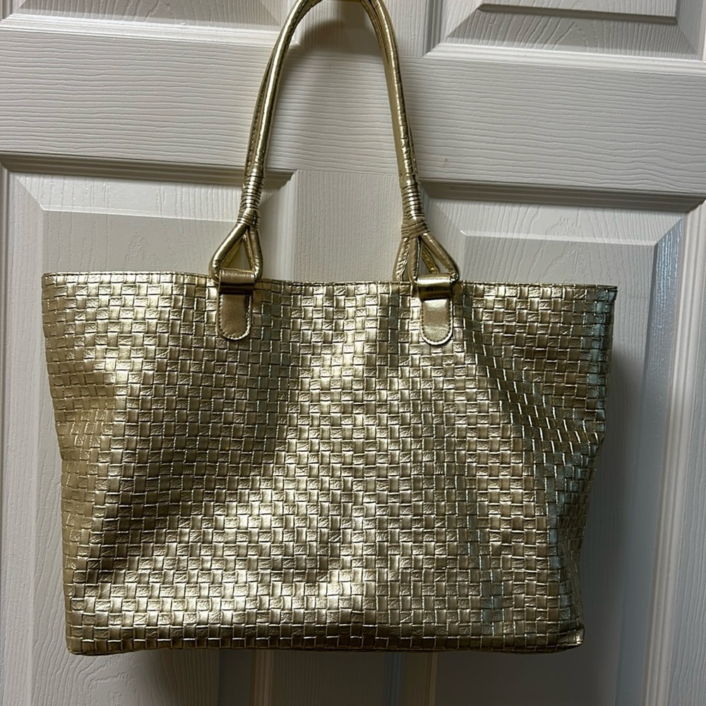 Liz Taylor gold travel bag